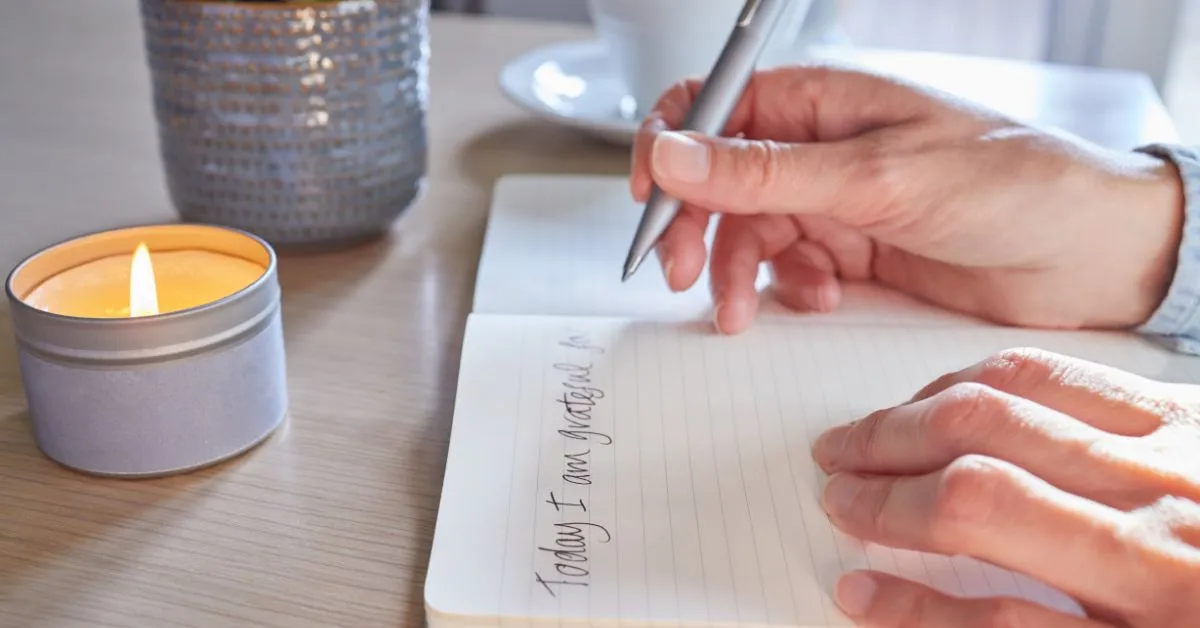 Woman journaling to manifest her desires